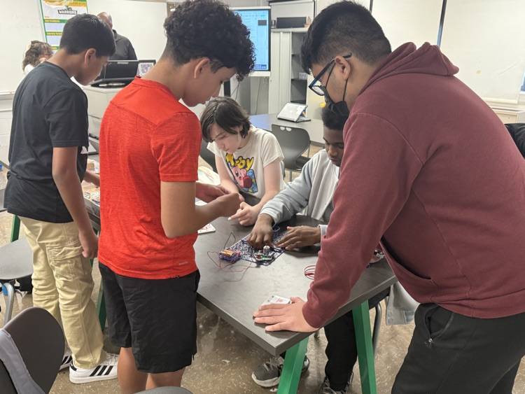 Photo of students and their drone