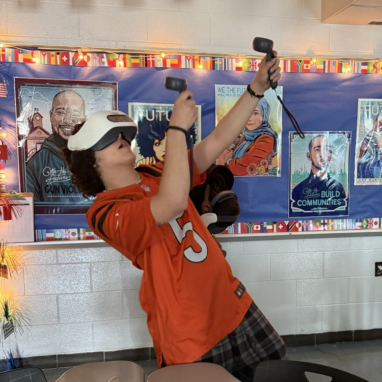 student playing with virtual reality set