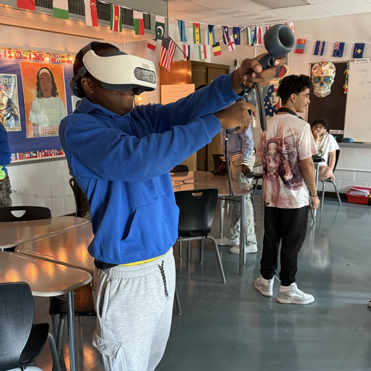 student playing with virtual reality set