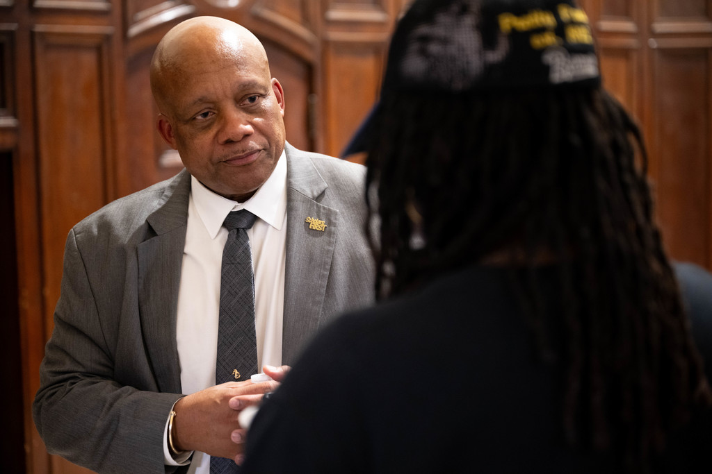 Dr. Yearwood talking with a community member. 