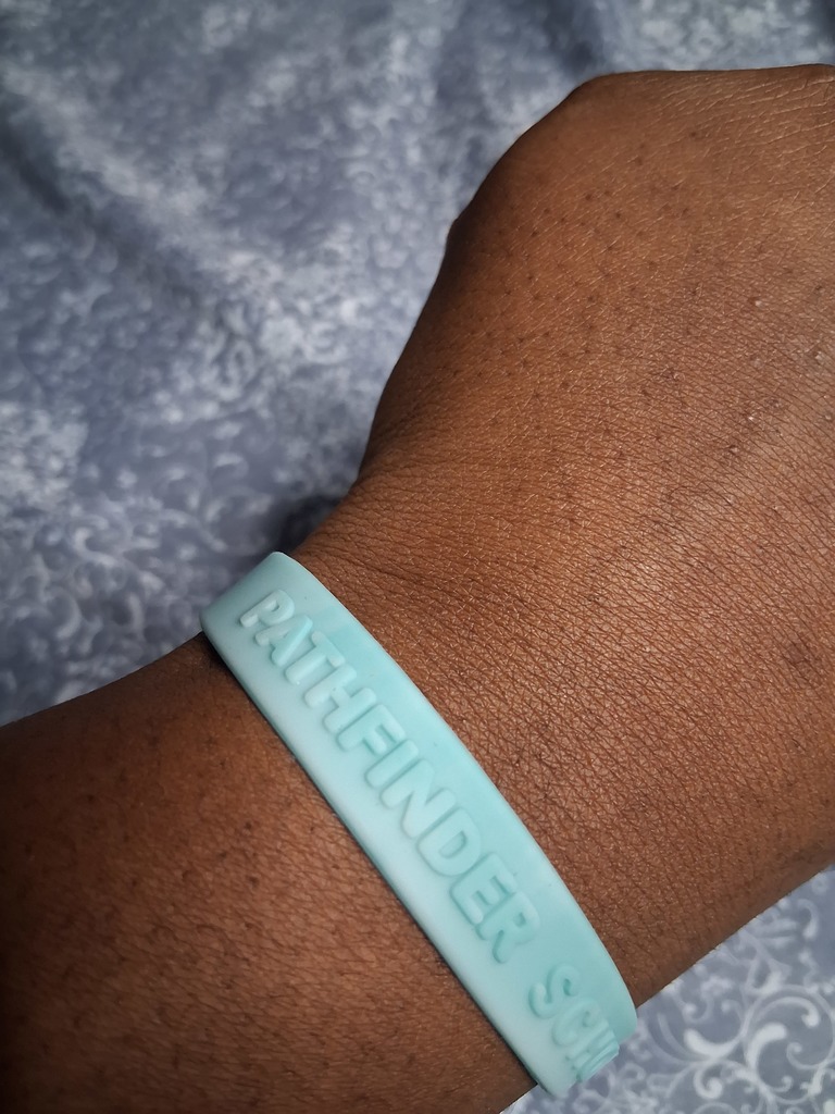 student wearing Pathfinder wristband
