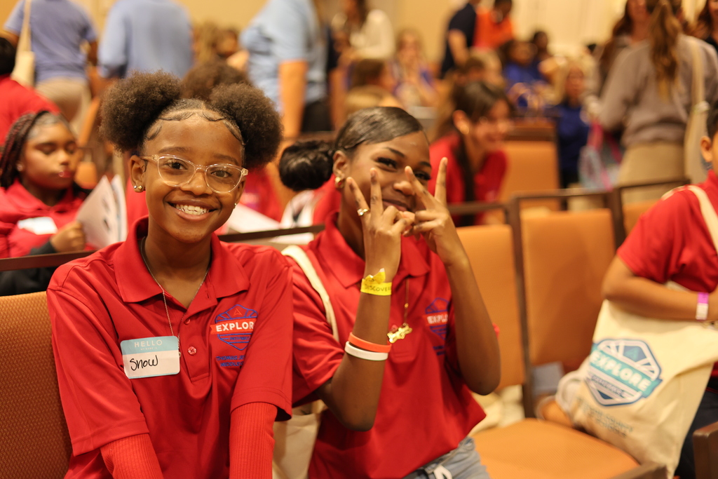 Students pose for a picture and smile.