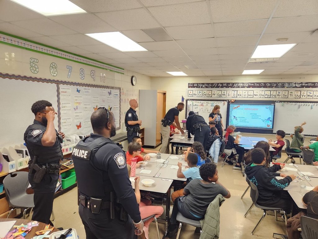 JCPS police officers host an ice cream party for Blake Elementary fourth-grade students.