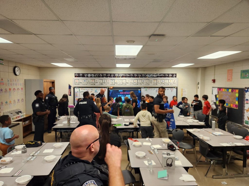 JCPS police officers host an ice cream party for Blake Elementary fourth-grade students.