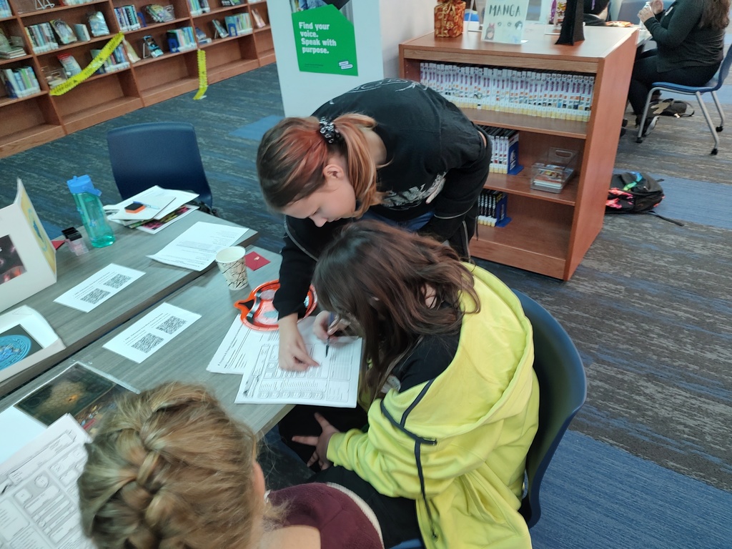 Student Dragon Master helping players understand how to play Dungeons and Dragons