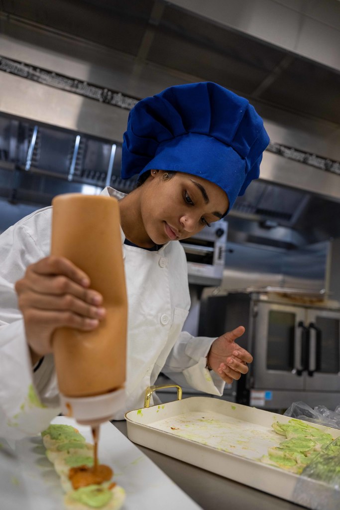 A student prepares food.