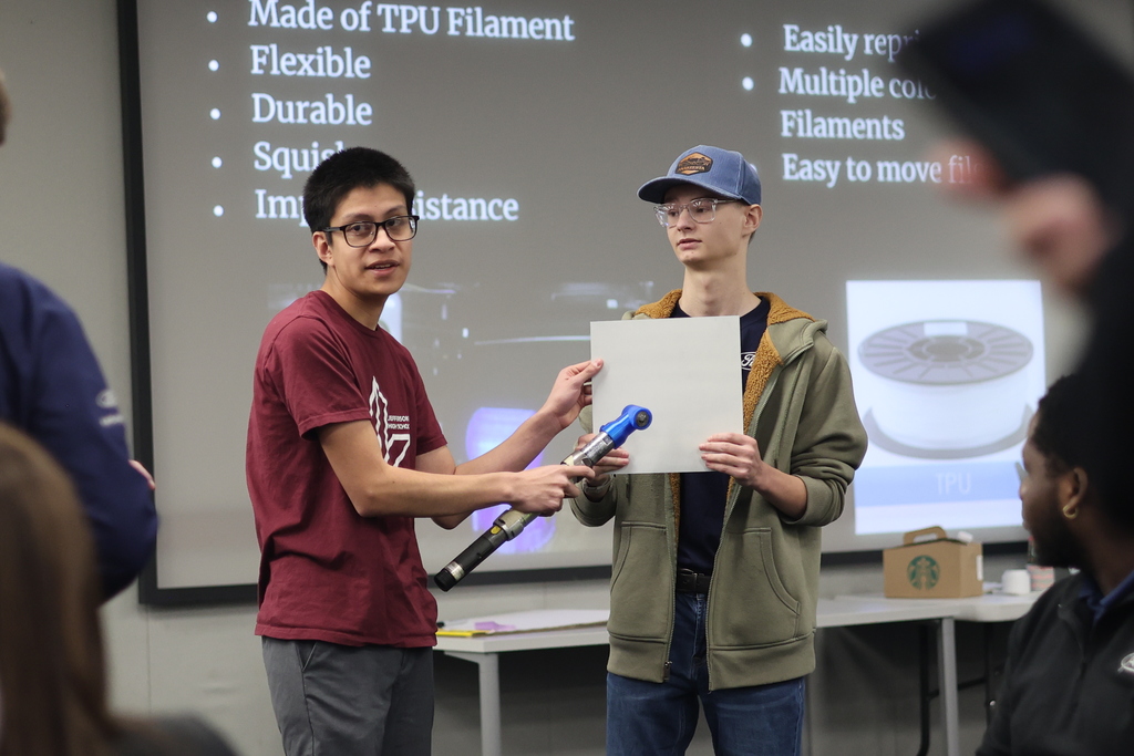 Our Jtown High CAD students just crushed it! 💪 They spent weeks designing a new part cover to solve a tricky paint chipping problem on the assembly line for Ford Motor Company. Today was presentation day, and they wowed the Ford leadership team with their final solution! Talk about applying what you learn. Hats off to our students for their engineering smarts! 🚀