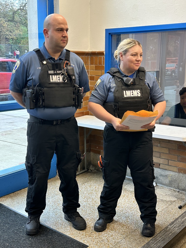 EMS workers looking at cards