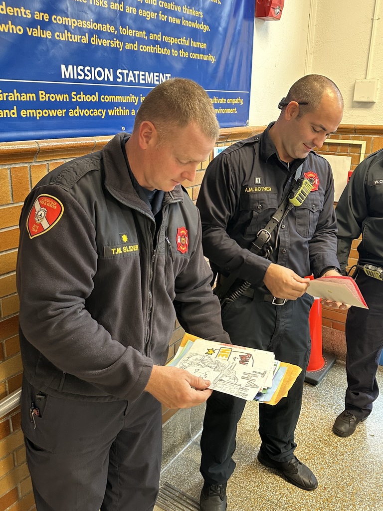 fire fighters looking at cards