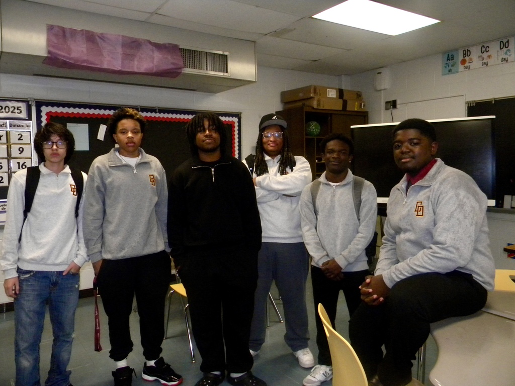 students in quarter zips in class