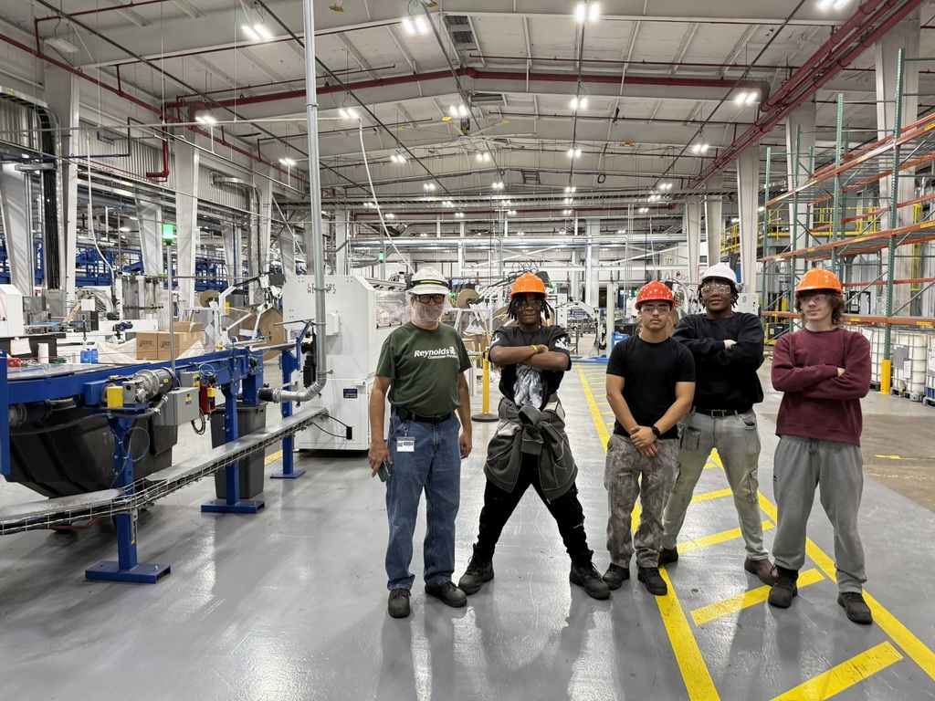 students inside Reynolds Wrap plant