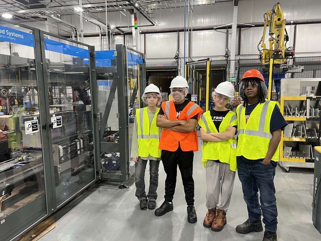 students inside Reynolds Wrap plant