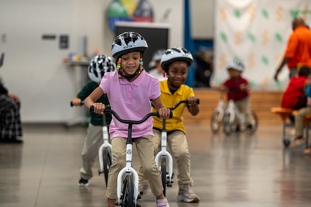 A student rides a bike.