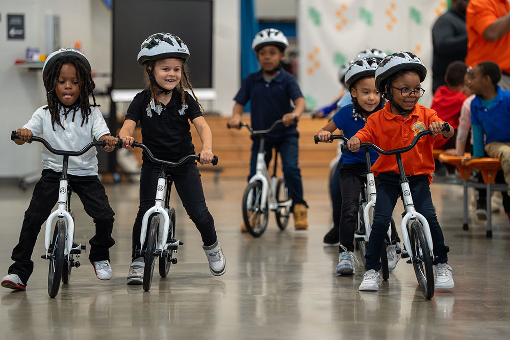 Students ride bikes. 