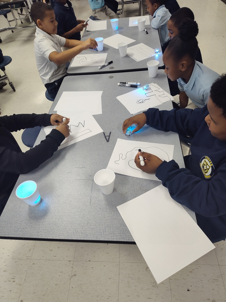 students exploring with ozobots
