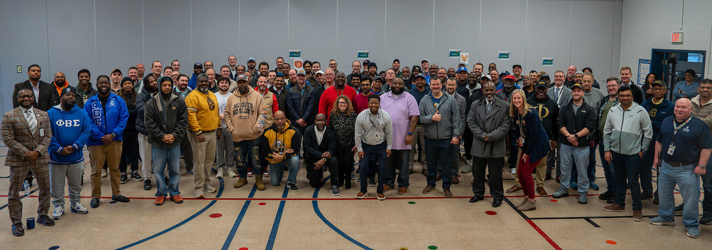 JCPS Flash Dads pose for a picture and smile. 