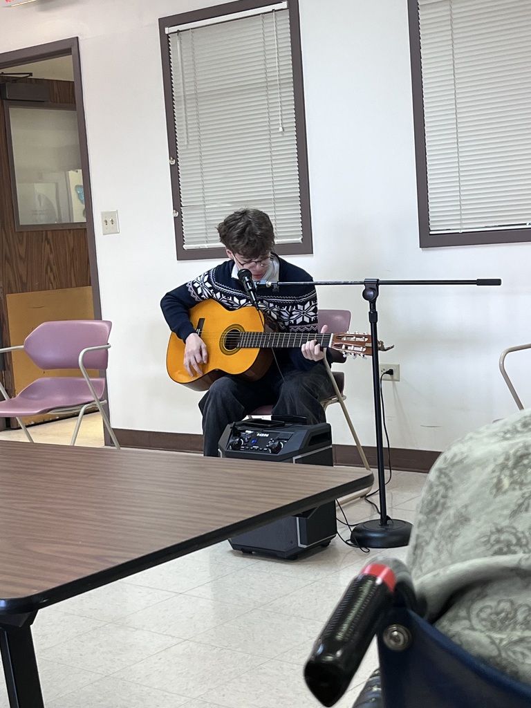 A student plays the guitar.