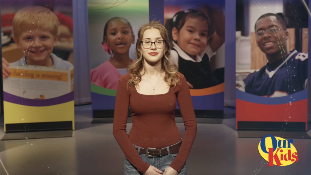 Screenshot from the Our Kids TV show featuring Desiree Robear speaking in a studio.