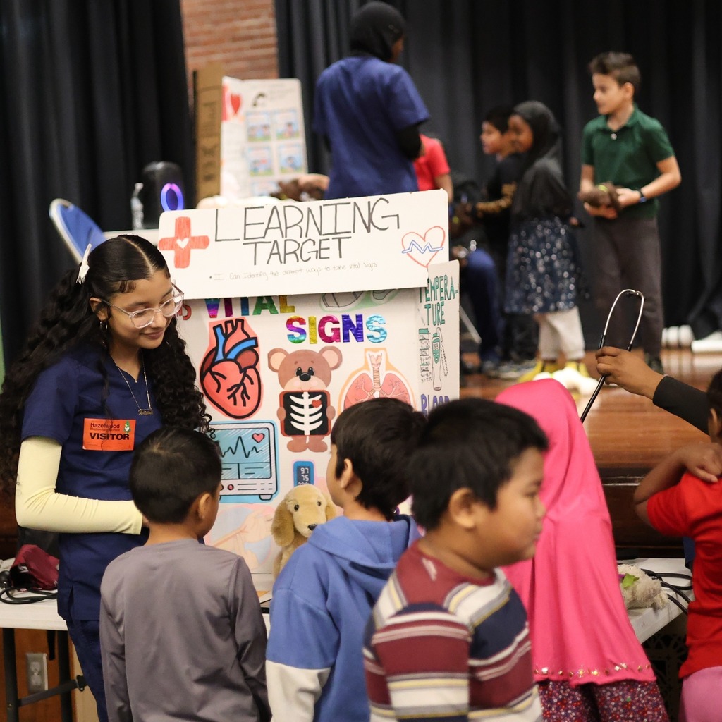 Photos from the Iroquois Teddy Bear Clinic featuring photos of high school and elementary school students doing health care-related activities. 