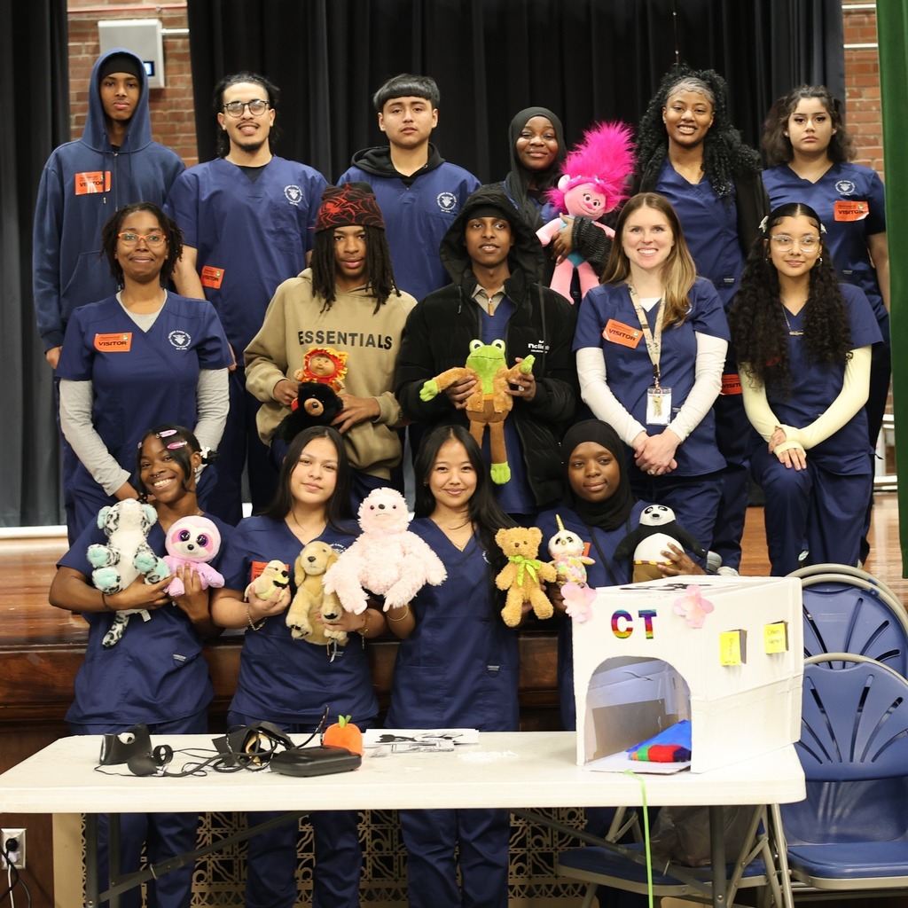 Iroquois High School students pose with teddy bears. 