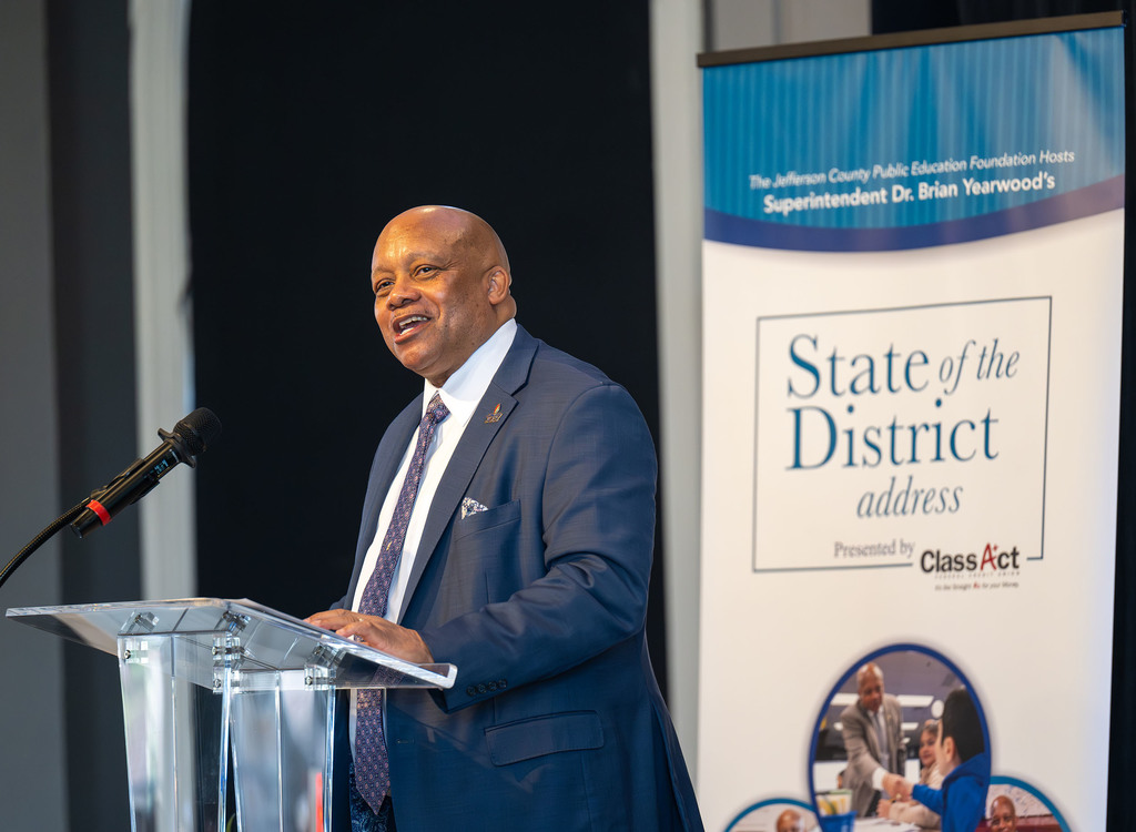 Dr. Yearwood speaks at a podium.