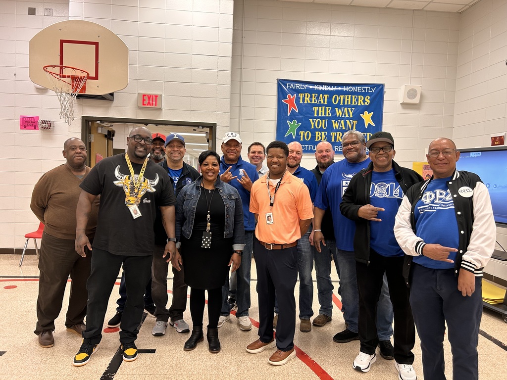 JCPS Flash Dad volunteers pose for a picture and smile. 