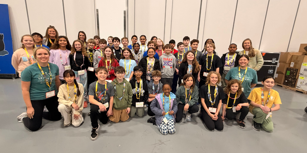 Students pose for a picture and smile.