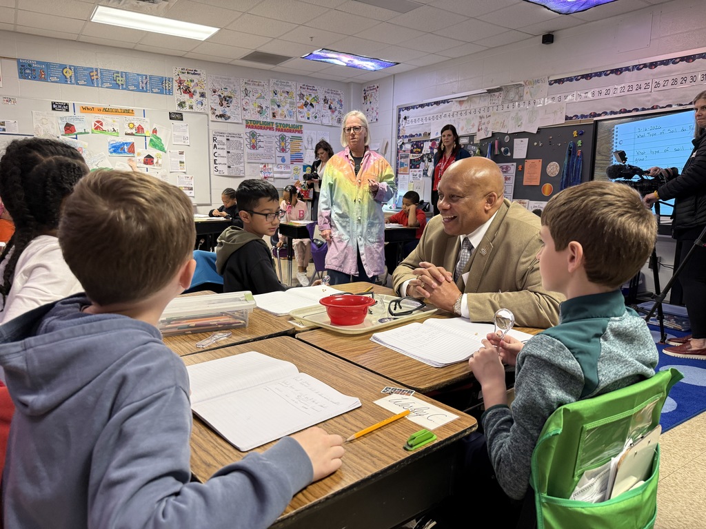 Dr. Yearwood talks to students at Tully Elementary.