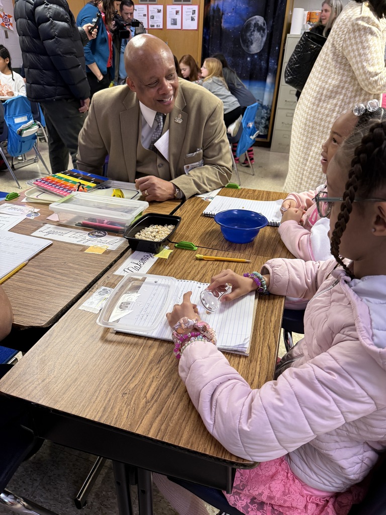 Dr. Yearwood talks to students at Tully Elementary.