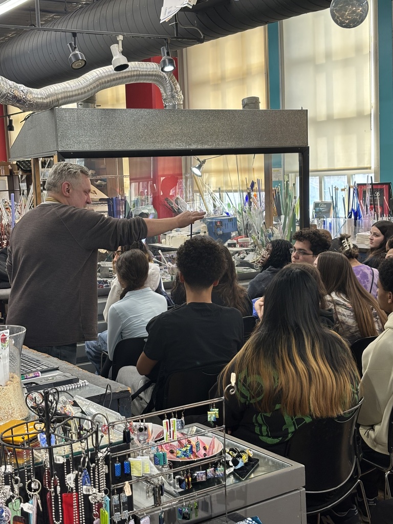 students interacting with local business owner