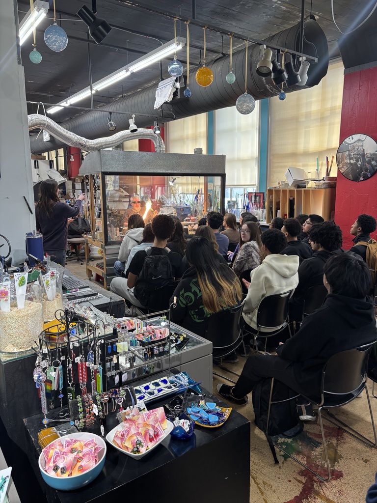 students watching live demo of torch glass work