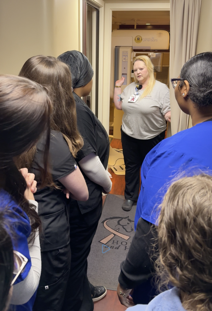 Students tour the mobile cancer screening unit.
