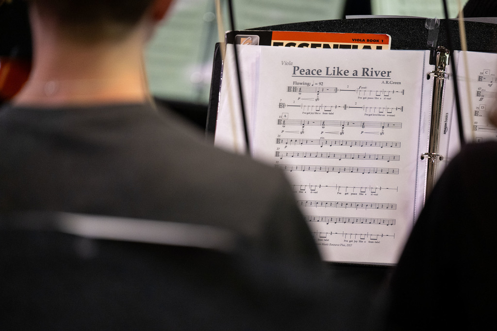 Sheet music sits on a stand.