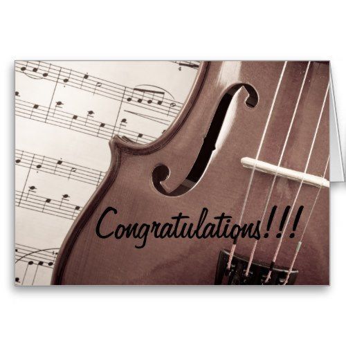Congratulations on a string instrument in front of a sheet of music