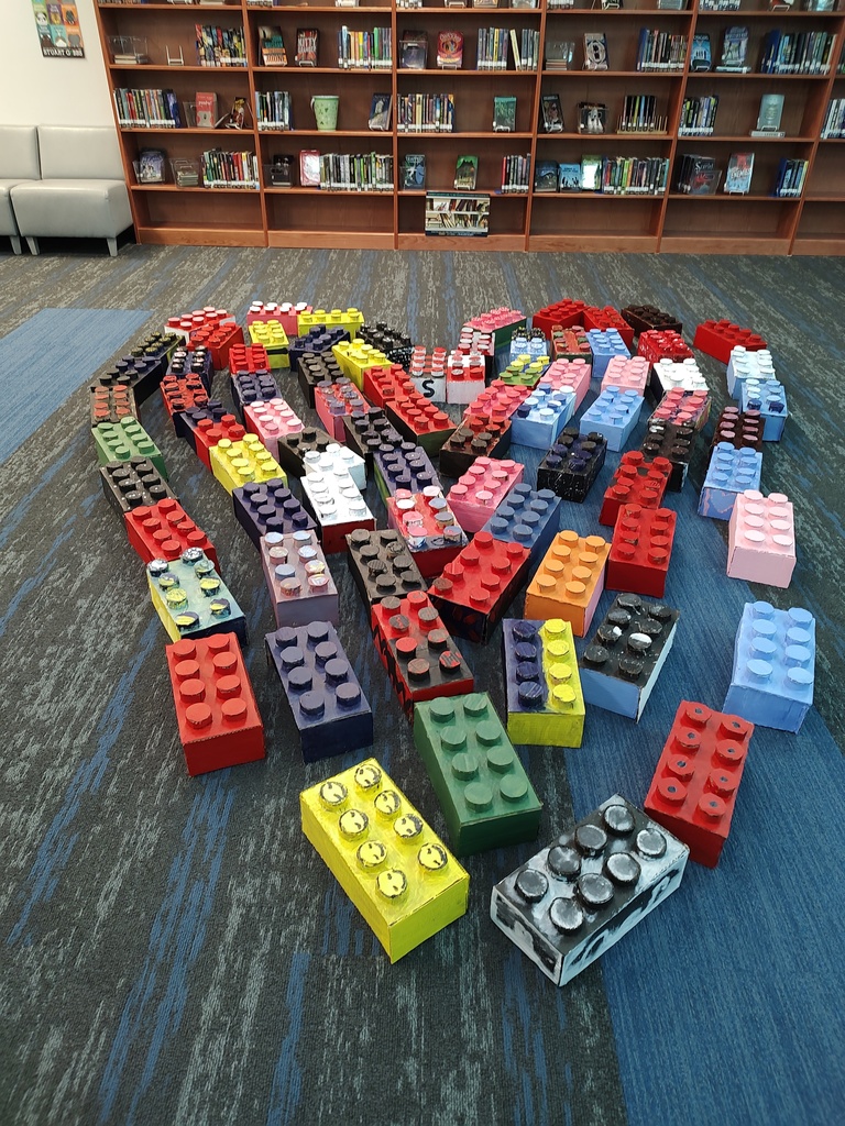 Heart built out of enlarged cardboard Legos which were made by art students at Johnson