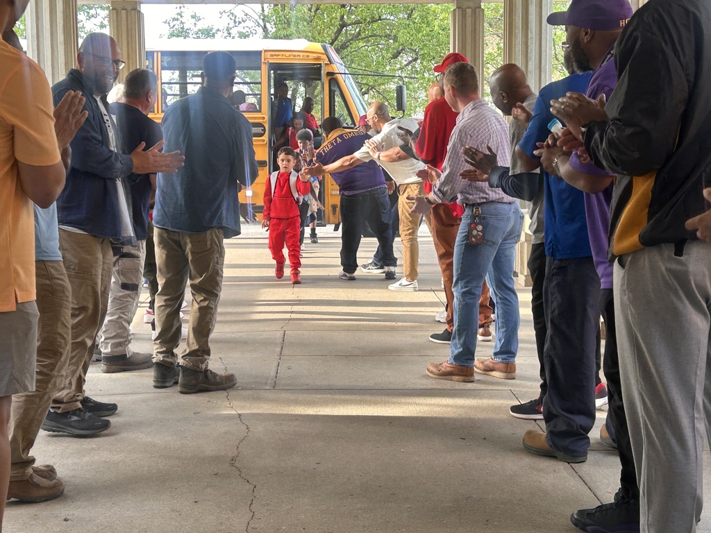 The JCPS Flash Dads cheer on students at Slaughter Elementary.