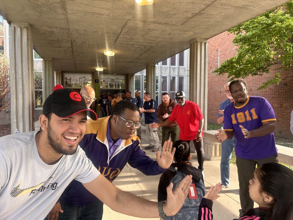 The JCPS Flash Dads cheer on students at Slaughter Elementary.