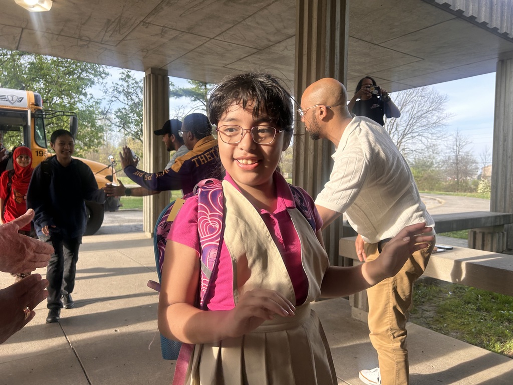 The JCPS Flash Dads cheer on students at Slaughter Elementary.
