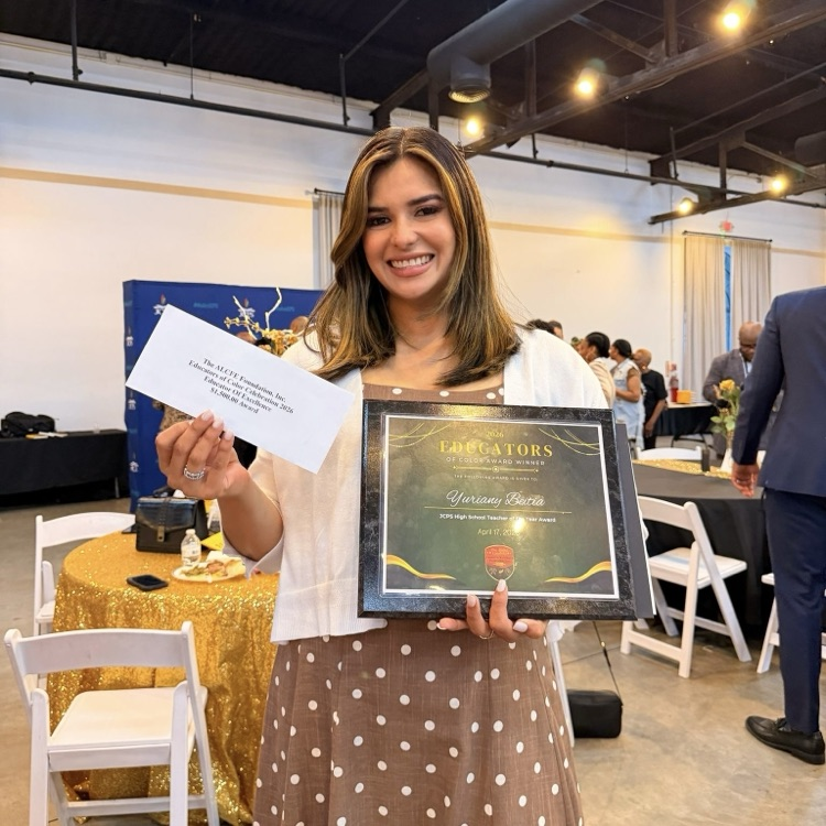 Ms. Beitia with awards