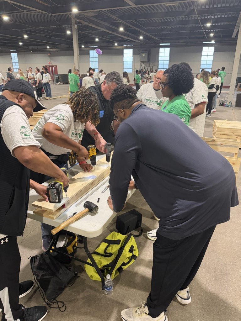 Volunteers participate in the Build-A-Bed event.