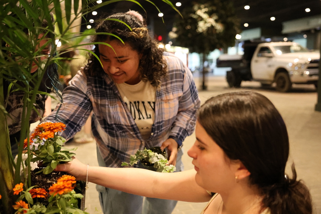 Students plants flowers.