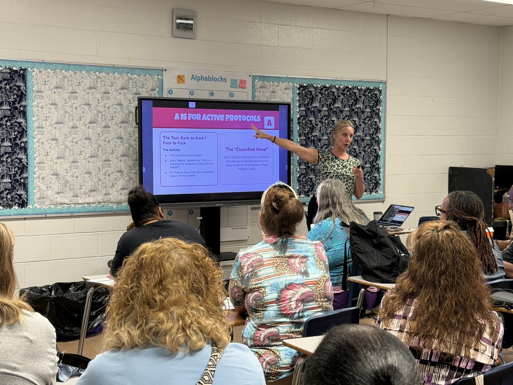 Adults participate in a professional development session.