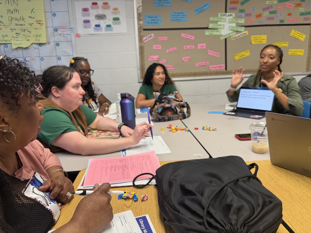 Adults participate in a professional development session.