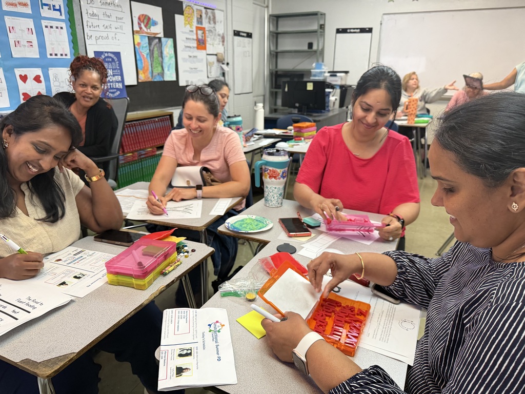 Adults participate in a professional development session.