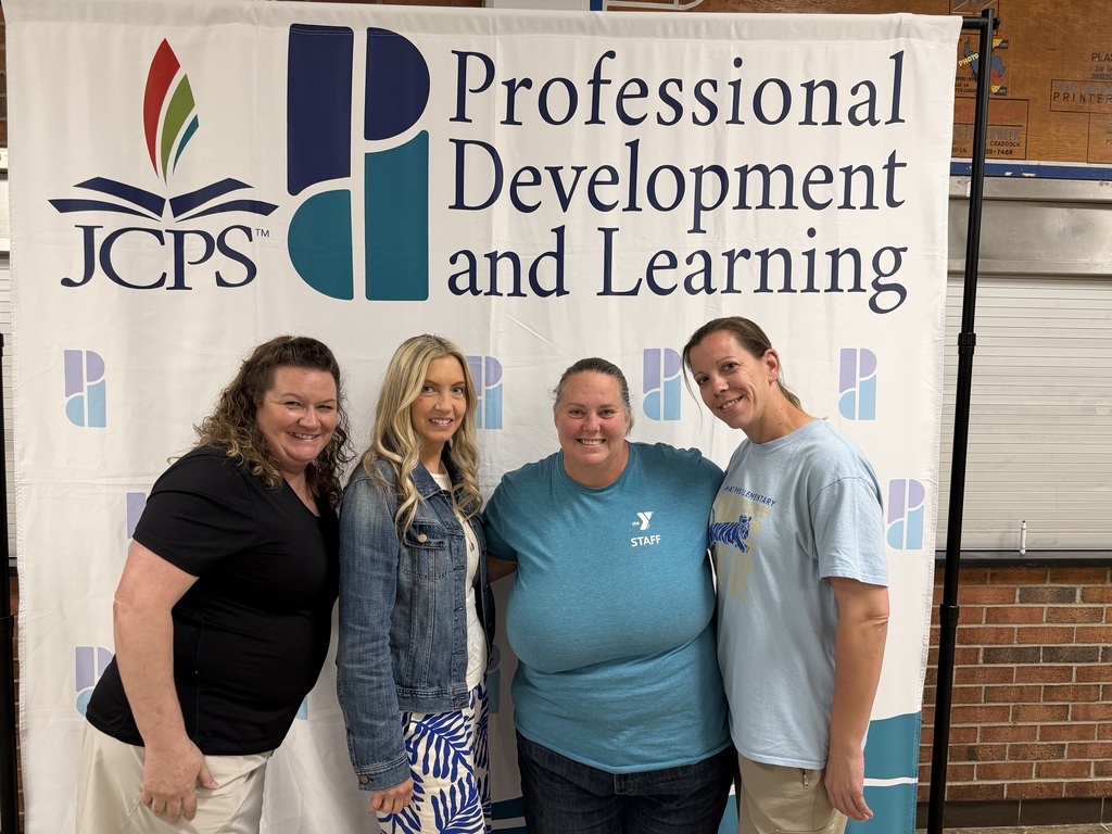 Four adults pose for a picture.