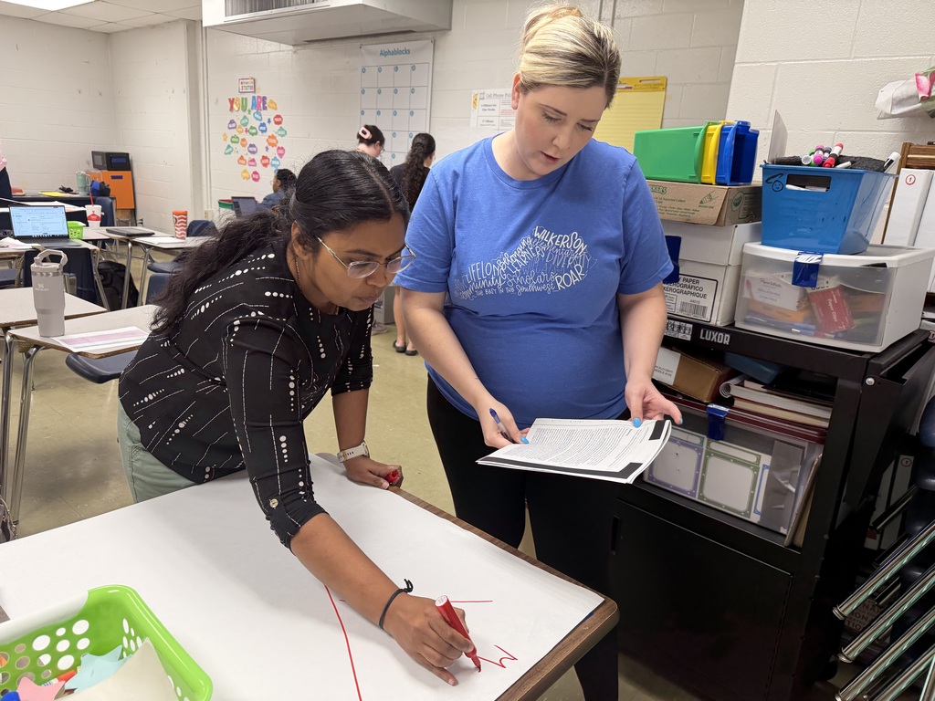 Adults participate in a professional development session.