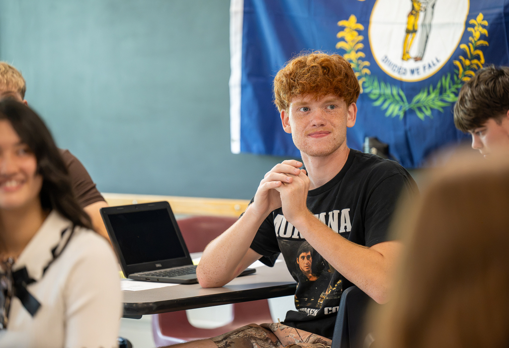 A student smiles.