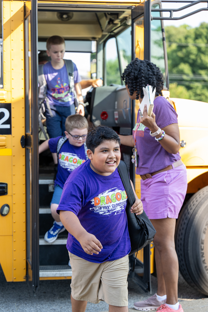 A student exits a school bus.