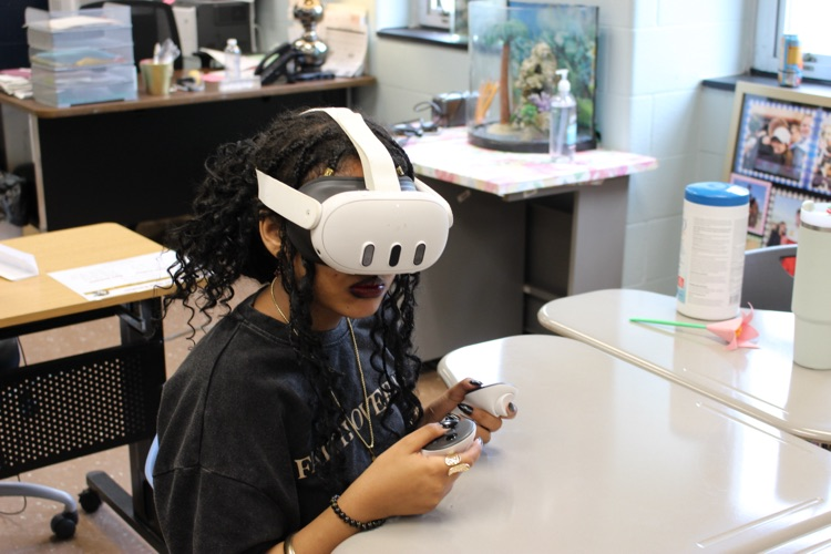 student with vr headset