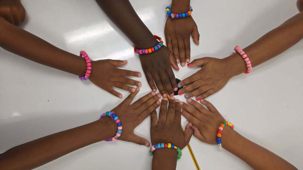 On Friday, Mrs. Benton's Kindergartners made bracelets out of beads as they practiced their touch counting to 10 as a Fun Friday math project.